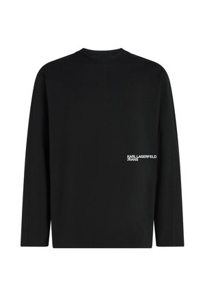 T-shirt noir à manches longues avec col rond et petit logo blanc "Karl Lagerfeld Jeans" en bas à droite devant.