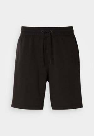 Schwarze Baumwollshorts mit einem elastischen Bund, Kordelzugdetails, seitlichen Taschen und einem lässigen Schnitt. Glatte Textur und knielanges Design.