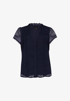 Blouse bleu marine à manches courtes en tissu transparent à pois, avec un col volanté et une fermeture à boutons, caractérisée par des coutures décoratives et un délicat bord.
