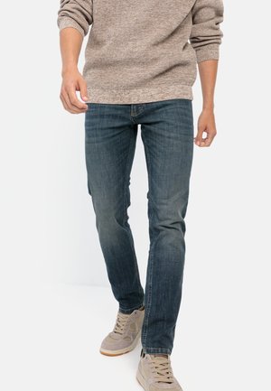 - Jeansy Slim Fit