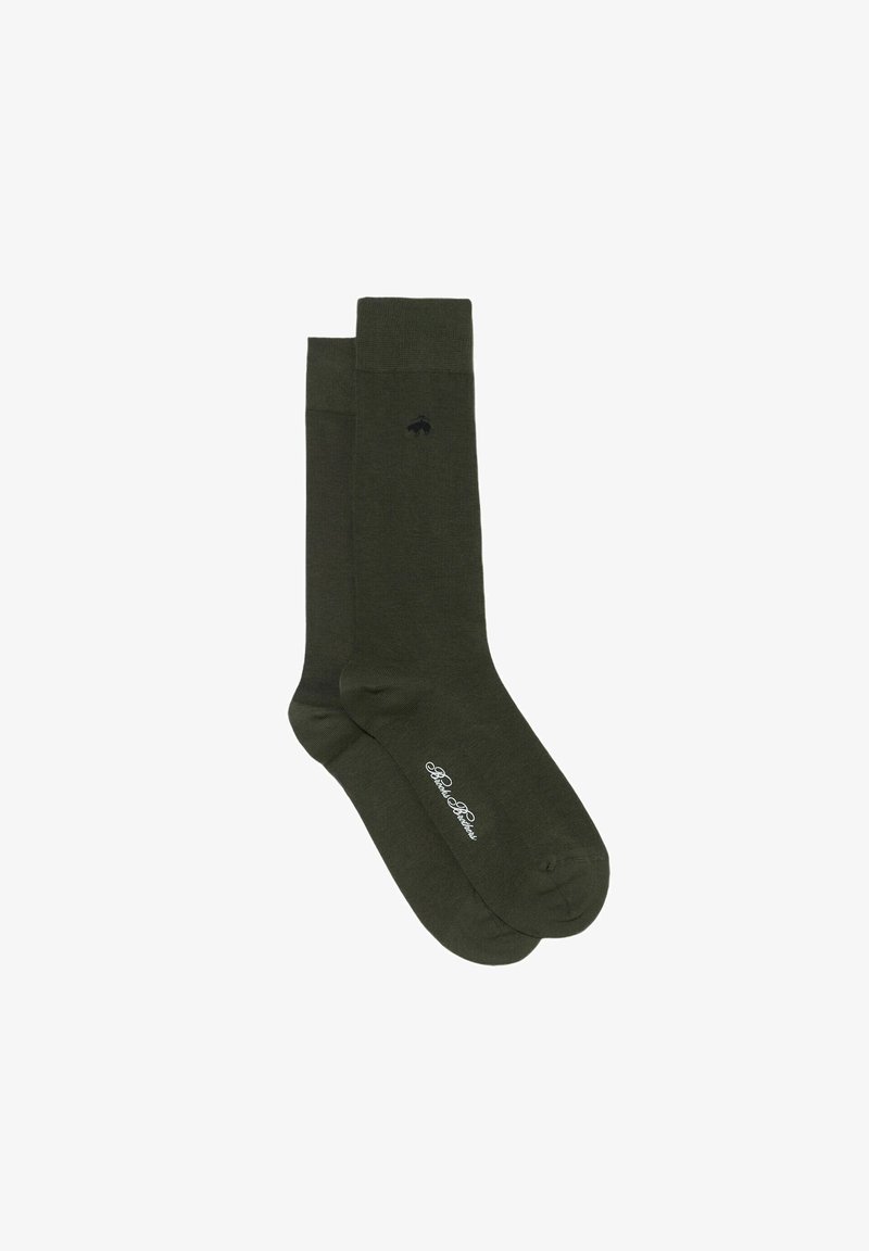Chaussettes en coton vert foncé avec bord-côte côtelé, présentant un petit emblème noir et un texte de marque blanc près des orteils. Texture lisse sur toute la surface.