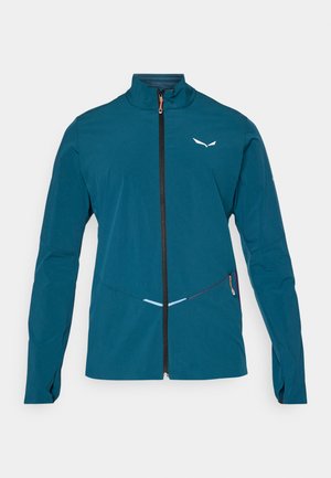 Teal värvi jakk, millel on kõrge kaelus, esikülje tõmblukk ja kontrastne must tõmbluku rada. Varustatud värviliste aktsentidega ja tekstuurse kangaga.