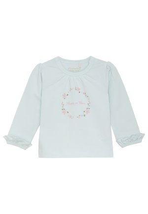Chemise à manches longues bleu clair en coton biologique, ornée d'un imprimé floral "Fleur en Épanouissement" et de poignets volantés.