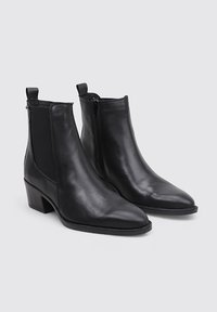 Black leather ankle boots featuring a sleek design, pointed toe, side zipper, and textured panel accents. Heeled sole for added elevation.