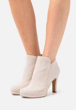 High heeled ankle boots - ivory