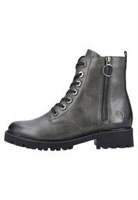 Groene leren enkelboot met vetersluiting aan de voorkant en ritssluiting aan de zijkant. Voorzien van een robuuste zwarte rubberen zool en metalen oogjes voor de veters.