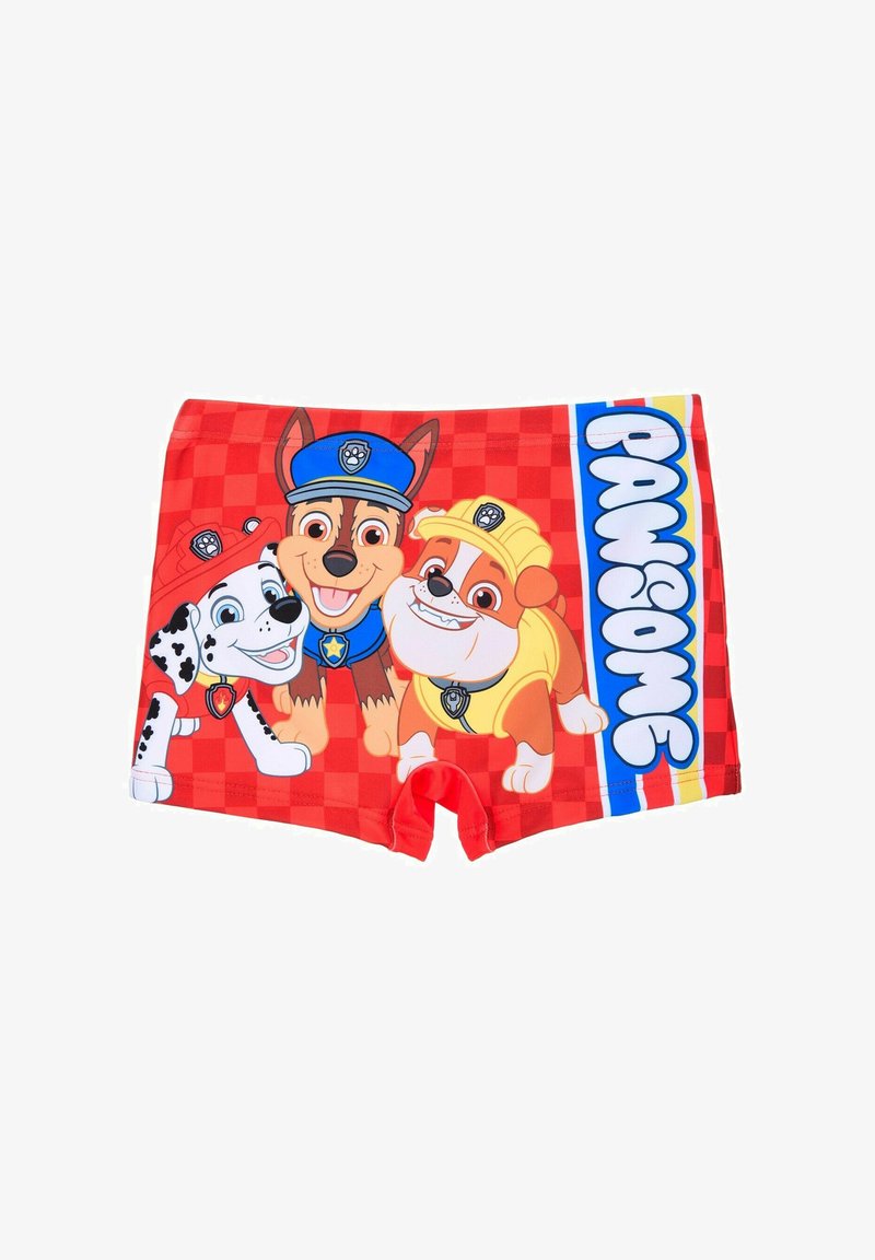 Boys' swim shorts made of red fabric featuring cartoon dogs: a spotted dog, a brown dog in a blue cap, and an orange dog with a yellow cap.