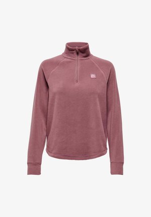 Fleece pullover in stoffige roze kleur met een halve rits bij de kraag, raglanmouwen en een klein logoplaatje op de linkerborst. Zachte textuur.