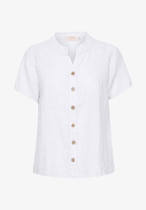 Chemise en lin blanc avec un col court et arrondi, dotée d'une fermeture à boutons en bois et de détails de couture verticaux.
