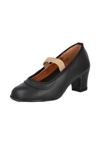 Zapato de cuero negro con punta redonda, tacón bajo y detalles de costura curva. Presenta una banda elástica beige sobre el empeine.