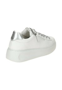 White leather sneaker with a rounded toe, metallic silver accents, textured laces, and a cushioned collar; thick, solid rubber sole.