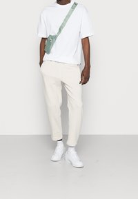 Nike Sportswear Träningsbyxor - beige