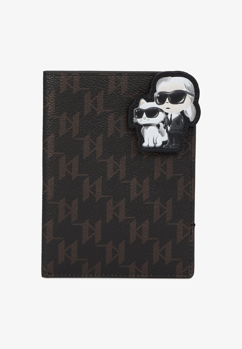 Monogrammed black wallet with a textured exterior, featuring a raised rubber charm of a character with sunglasses and a cat.