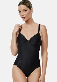 Zwarte bodysuit van gestructureerde stof, met gevormde cups, verstelbare bandjes en kanten accenten aan de zijkanten. Heeft een subtiel centraal gouden hardwaredetail.