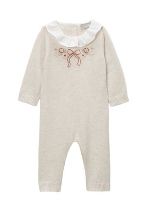 Combinaison en tricot beige clair à manches longues, col blanc à volants et broderie florale avec un nœud. Poignets côtelés aux chevilles.