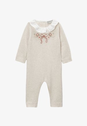Combinaison en tricot beige clair à manches longues, col blanc à volants et broderie florale avec un nœud. Poignets côtelés aux chevilles.