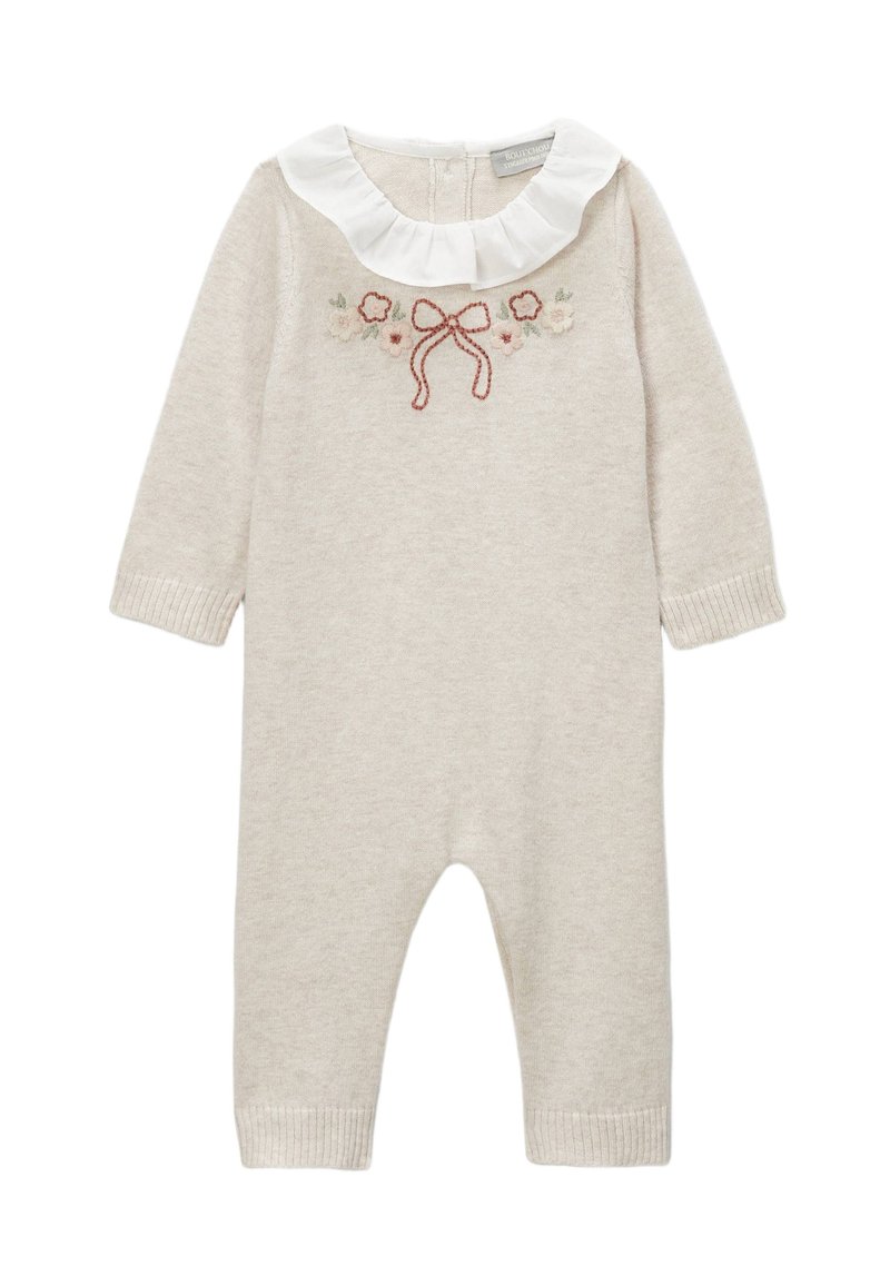Combinaison en tricot beige clair à manches longues, col blanc à volants et broderie florale avec un nœud. Poignets côtelés aux chevilles.