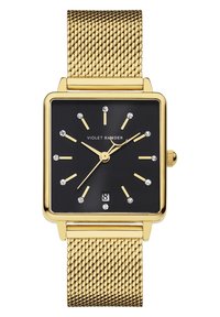 Montre avec bracelet en maille dorée, un cadran noir carré, des accents argentés et des marquages en forme de diamants, avec un affichage de la date en bas.