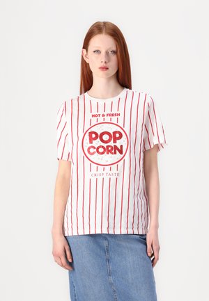 White t-shirt with red vertical stripes, featuring a circular "POP CORN" graphic in the center with "HOT & FRESH" and "CRISP TASTE" text.