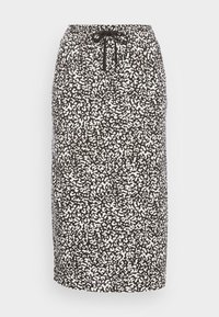 Midi spódnica o czarno-białym wzorze z elastycznym pasem i sznurkiem do regulacji. Gładka tkanina o subtelnej fakturze i luźnym kroju.
