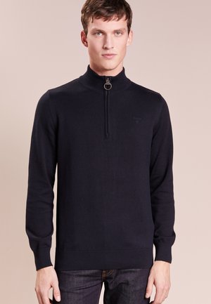 Navy blauwe zip-hals trui gemaakt van breiwerk, met lange mouwen en geribde manchetten en zoom; subtiele logo-detail nabij de borst.