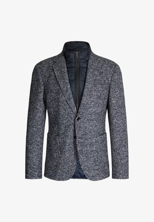 Blazer en mélange de laine avec un motif pied-de-poule bleu marine et gris, équipé d'une doudoune zippée en dessous, revers crantés et deux poches avant.
