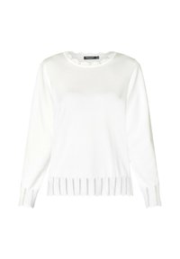 Hvid strikket sweater med lange ærmer, en bølget halsudskæring og et bladmønster ved kanten og ærmerne, der har en glat tekstur.