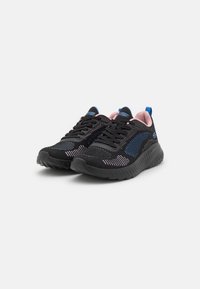 Black athletic shoes with a textured upper, blue accents, pink interior, and a thick, cushioned sole. Features laces and breathable mesh.