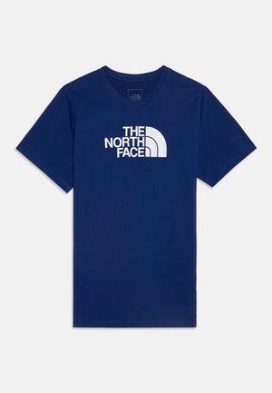 T-shirt bleu marine à manches courtes avec col rond et logo blanc "The North Face" centré sur la poitrine.