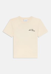 Kurzärmliges cremefarbenes T-Shirt aus Baumwolle mit einem schwarzen gestickten "Les Deux"-Logo auf der linken Brustseite. Sanfte Textur, reguläre Passform.