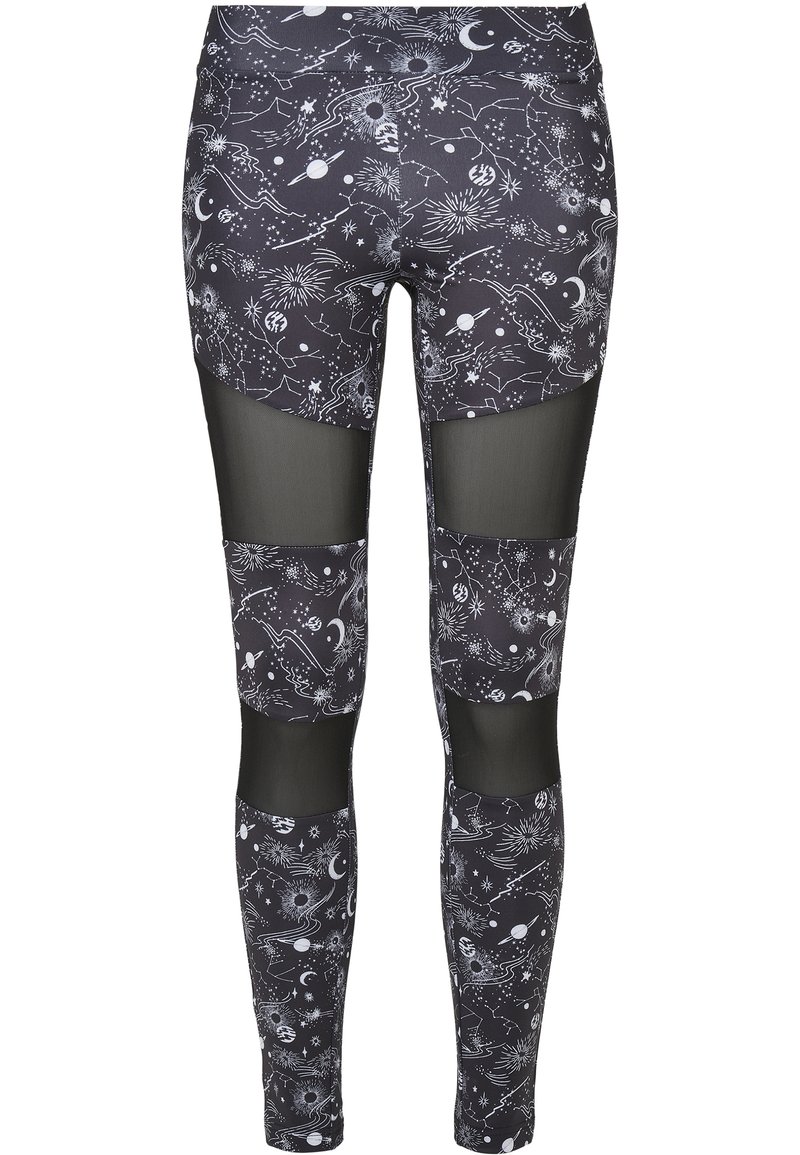 Svarta leggings med ett kosmiskt mönster som visar vita stjärnor, planeter och konstellationer; inkluderar genomskinliga meshpaneler på låren.