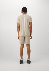 Björn Borg ACE SHORTS - Spordišortsid - pelican