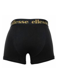 Boxer noir avec logo "ellesse" doré sur la ceinture, présenté de dos sur fond blanc.