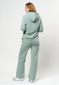 U.S. Polo Assn. GITA  - Treniņtērpa apakšdaļas - green milliue