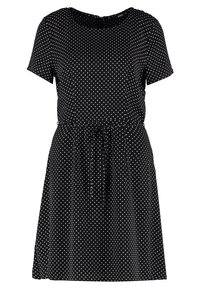 Robe noire à manches courtes avec des pois blancs, taille cintrée avec lien, et encolure ronde. Le tissu léger ajoute de la fluidité et du mouvement.