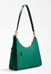 Grøn croc-præget læderhåndtaske med lynlås og hardware i guldton, der har en skulderrem og en lynlåslomme foran.