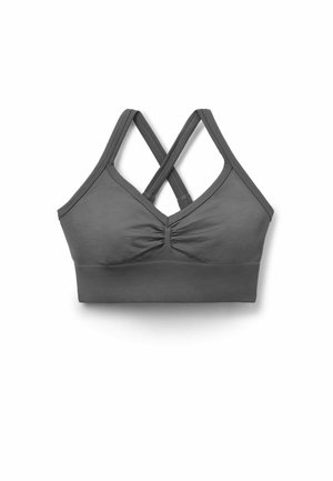 Brassière de sport grise avec bretelles croisées dans le dos et fronces au centre devant, conçue pour le maintien et le confort.