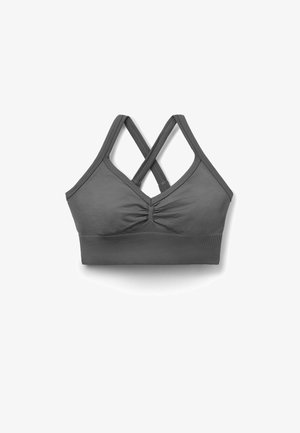 Szary sportowy biustonosz z krzyżującymi się ramionami i marszczonym środkiem z przodu, zaprojektowany dla wsparcia i komfortu.