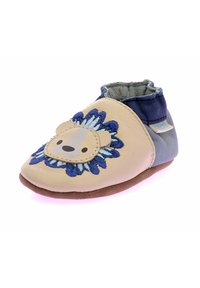 Scarpa in pelle tan con un motivo floreale blu ricamato e una faccia di leone. Suola in morbido suede, elasticità alla caviglia per un facile indossamento. Forma della punta arrotondata.
