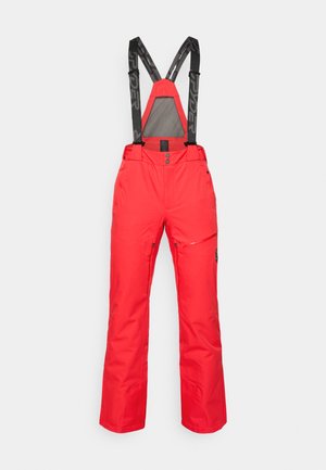 Red snow pants with adjustable black suspenders. Features snap closure, side pockets, and a waterproof material. Straight leg design.