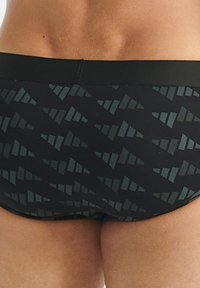 Mustat uimapuvut, joissa on tummanvihreä geometrinen kuvio, sileä ja joustava vyötärönauha sekä tiukka malli.