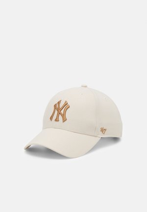 Off-white baseball cap with curved brim, featuring brown embroidered interlocking "NY" logo on front and "47" on side.