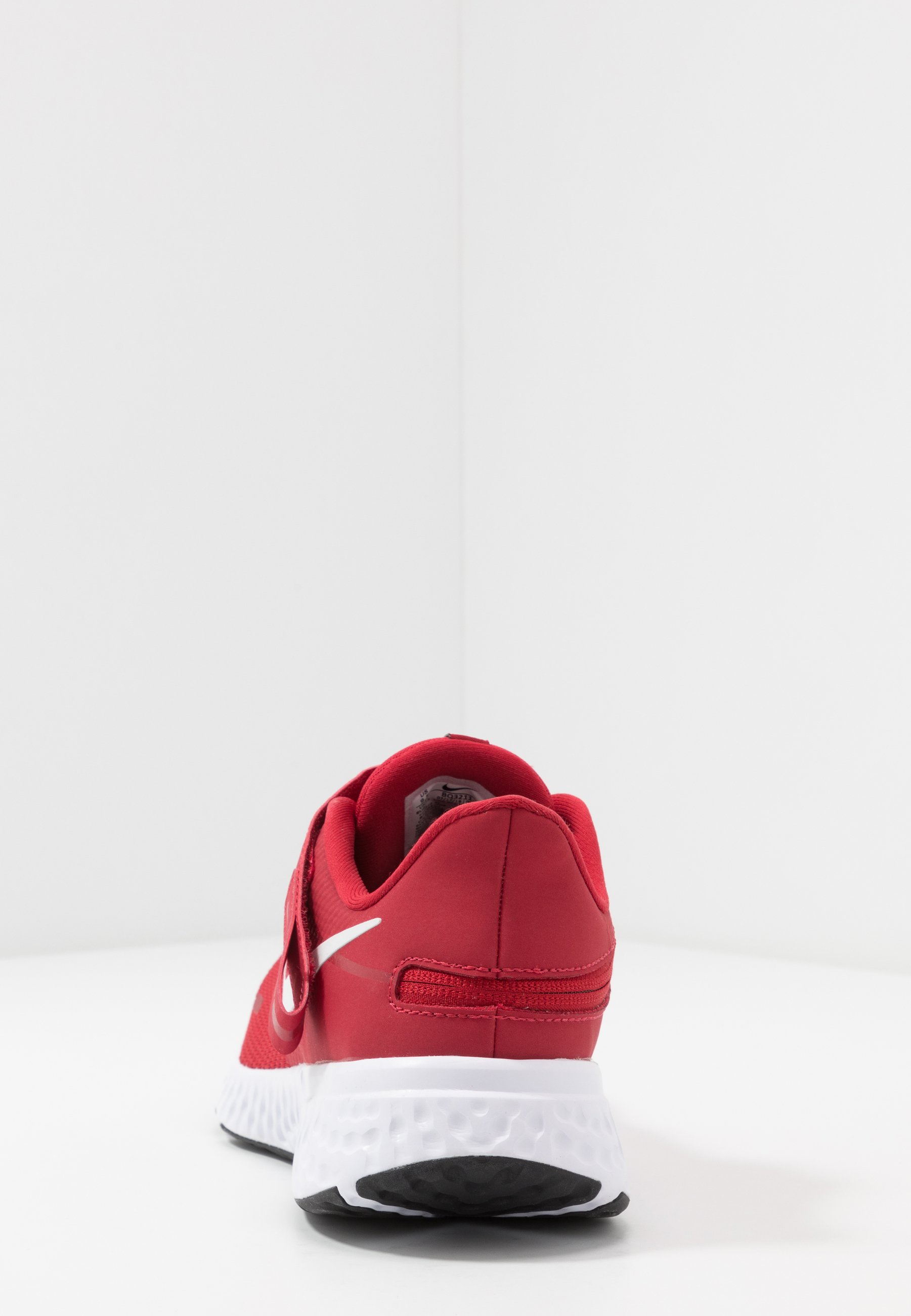 white and red running shoes