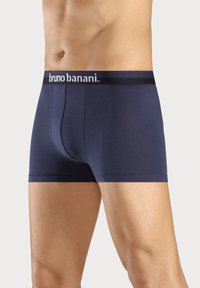 Marinblå bomullskalsonger med svart elastiskt midjeband som pryds av "bruno banani"-logotyp, åtsittande passform, kort benlängd och slät yta.