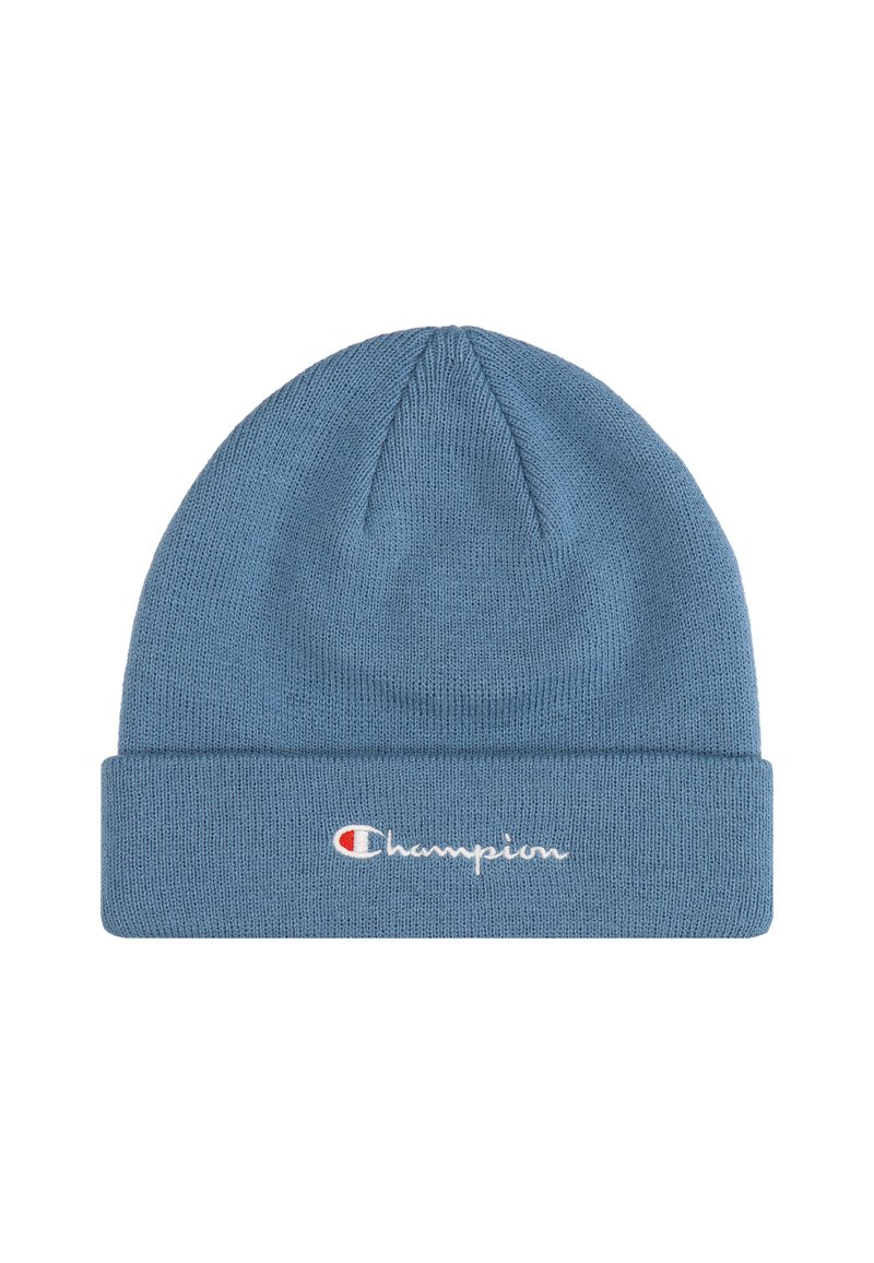 Gorro de punto azul con puño acanalado, que presenta el logotipo bordado en blanco de "Champion" y un pequeño acento rojo en el diseño del logotipo.
