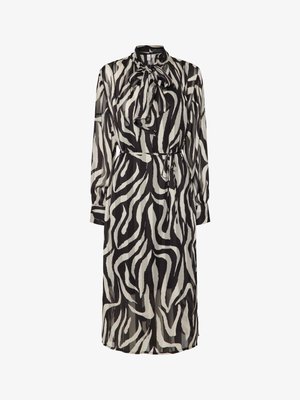 Abito lungo con motivo a zebra bianco e nero, collo alto, dettaglio con nodo e vita stretta. Tessuto trasparente e maniche lunghe.