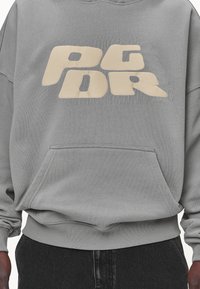 Pegador Jersey con capucha - grey