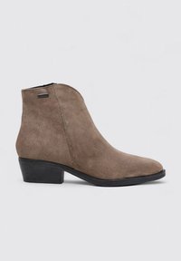Brown suede ankle boot featuring a pointed toe, slender block heel, and side zip closure for easy wear. Smooth texture with minimal hardware.