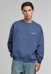 Another Cotton Lab BAD IDEAS GOOD STORYS OVERSIZE - Bluză de molton - blue
