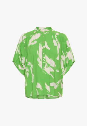 Zöld ing fehér ecsetvonás mintákkal, magas nyakkal, elülső gombokkal és laza, rövid ujjakkal. Puha anyag, kényelmes szabás.